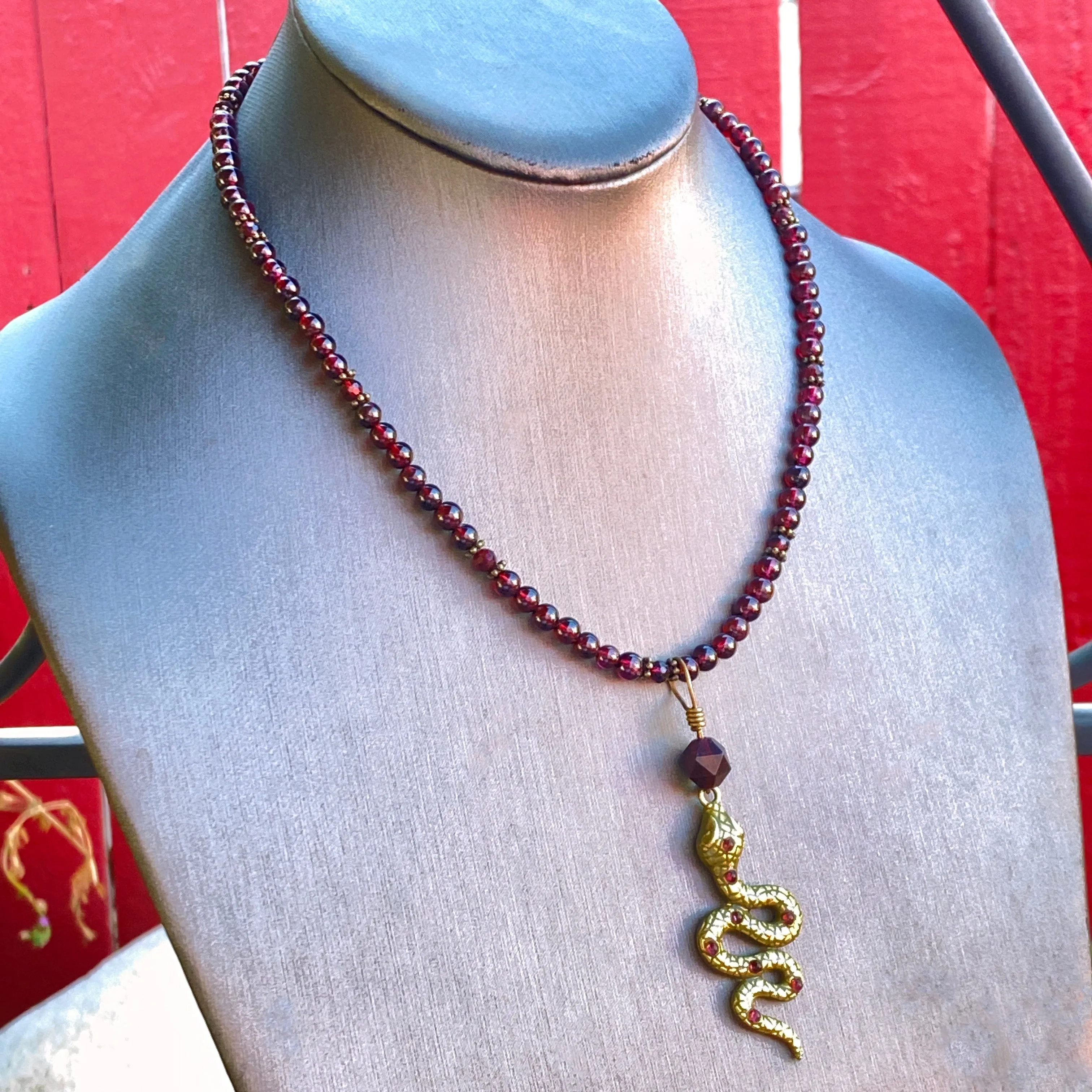 Garnet gemstone and Brass Snake pendant Necklace