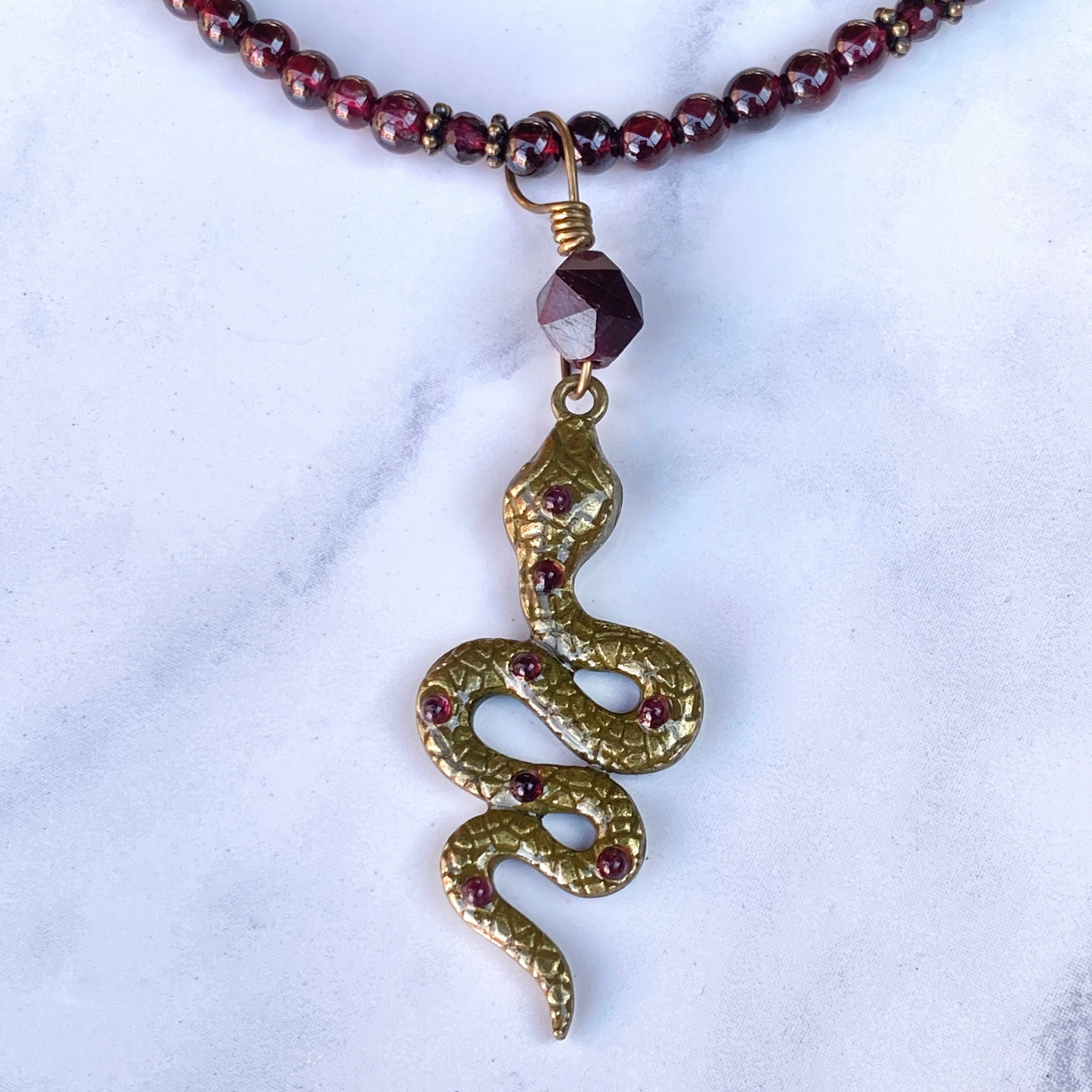 Garnet gemstone and Brass Snake pendant Necklace